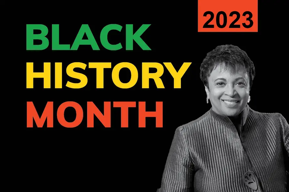 Black and white photograph of Librarian of Congress Carla Hayden in the foreground next to red, yellow, and red text that reads "Black History Month 2023."