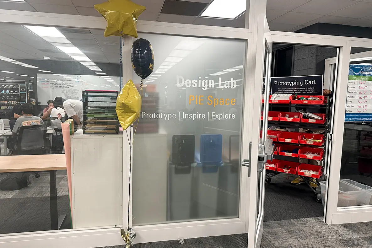 Entrance to the PIE Space with a prototyping cart full of materials in view.